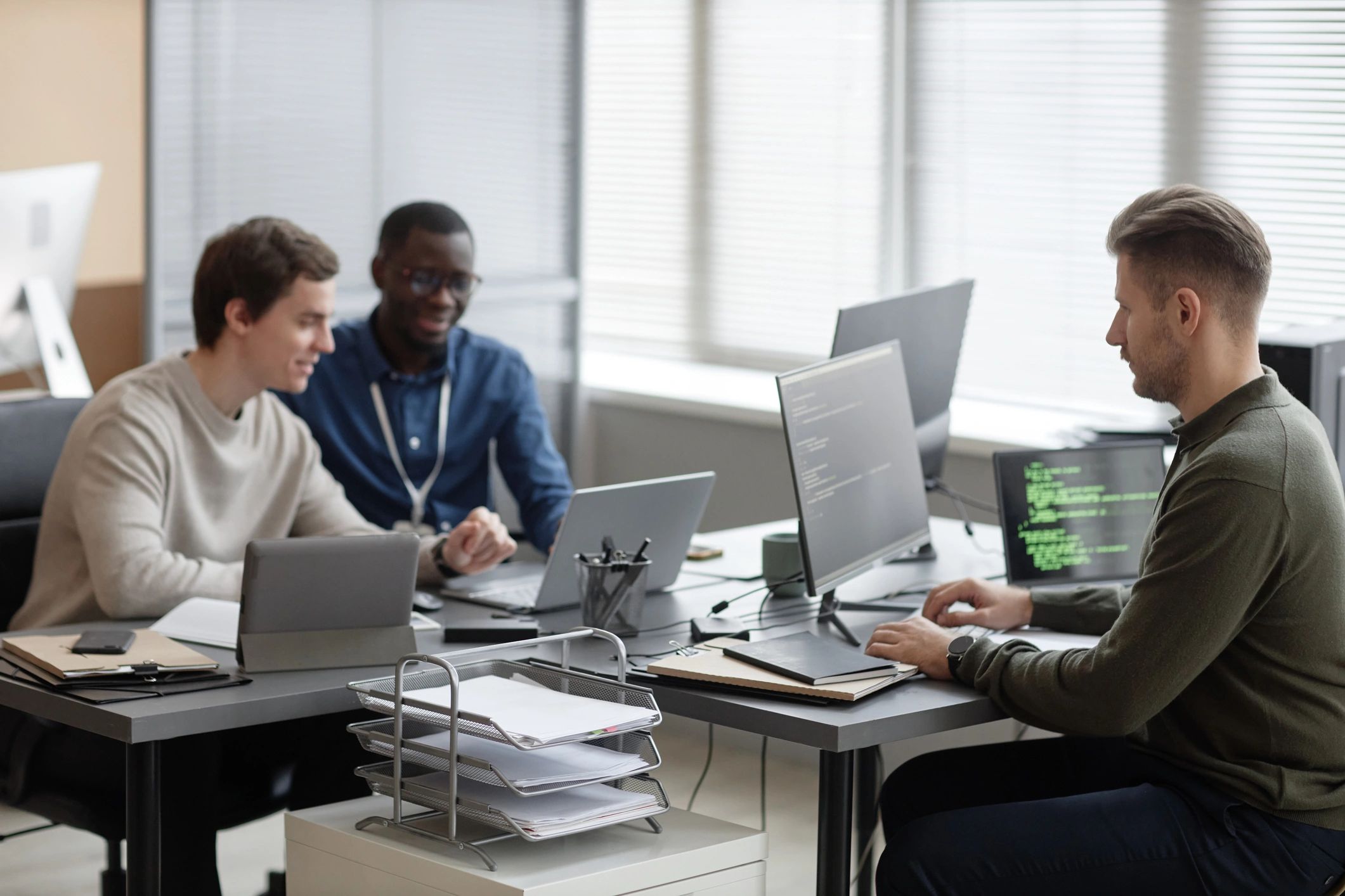Cybersecurity team collaborating in a modern office